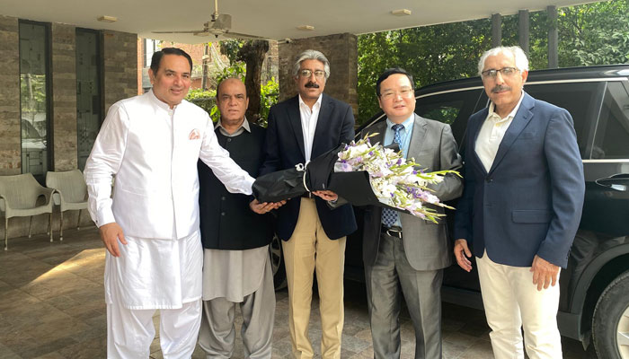 Chinese Consul General Mr Zhao Shirin (centre right) is being presented flowers bouquet during his visit to Finance Secretary of PPP Central Punjab Rana Jawads (centre) house on April 30, 2025. — Facebook@jawad.rana.54