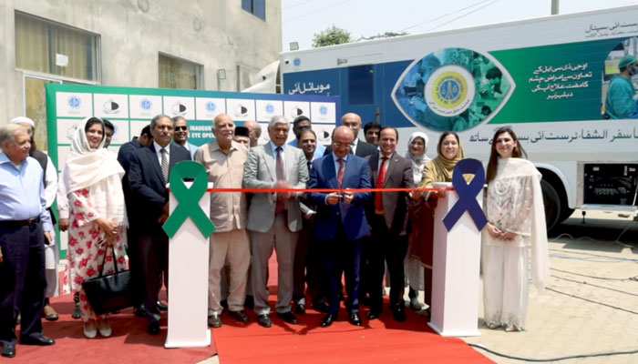 OGDCL Managing Director Ahmed Hayat Lak (centre) cuts ribbon to launch mobile operation theatre (OT) at THQ Hospital Fateh Jang on April 30, 2025. — Screengrab via Facebook@alshifaeyerwp