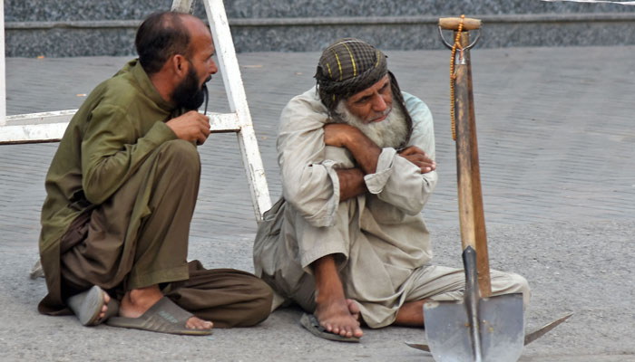 Labourers are sitting along a road with their tools waiting for customers, on the eve of International Labour Day, at Chandni chowk area in the city on April 30, 2025. — Online