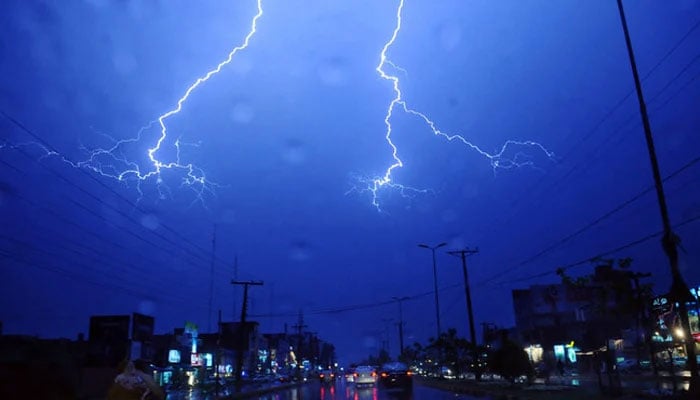 A lightning is pictured over Lahore city during a thunder storm that was followed with heavy rain. — AFP/File