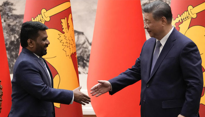 Chinese President Xi Jinping (right) shakes hands with Sri Lankan President Anura Kumara Dissanayake during a signing ceremony at the Great Hall of the People in Beijing on January 15, 2025. —AFP