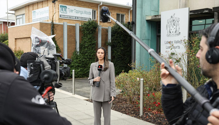 Journalists outside the Latrobe Valley Magistrates Court building in Morwell, where an Australian woman is charged of murdering three people with a toxic meal. —AFP/File