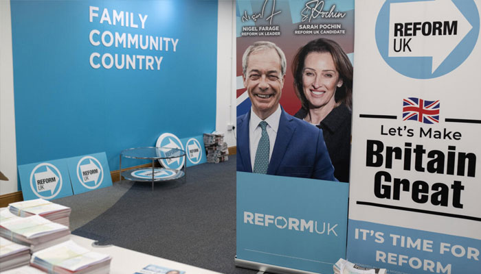 Standies with the posters of election compaign can be seen. —AFP/File