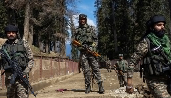 Indian security force personnel stand guard at the site of an attack on tourists in Baisaran near Pahalgam in IIOJKs Anantnag district on April 24, 2025. — Reuters