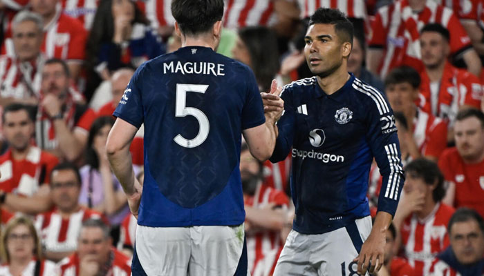 Manchester United midfielder Casemiro celebrates his goal with Harry Maguire. — AFP/File