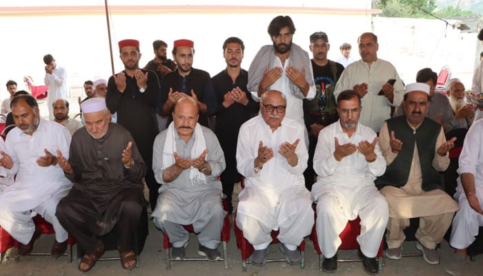 Awami National Party (ANP) Khyber Pakhtunkhwa president Mian Iftikhar Hussain (centre right) offers condolences on the death of Khudai Khidmatgar Mian Jamal Shah Yousafzai at Balambat village in Lower Dir district on May 2, 2025. — Facebook@ANPMarkaz