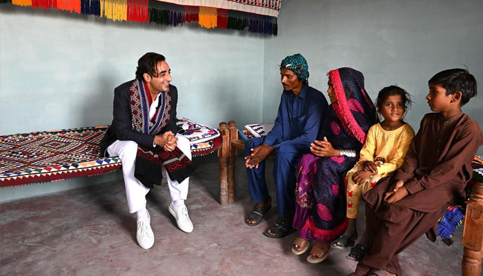Pakistan Peoples Party (PPP) Chairman Bilawal Bhutto Zardari with flood -affectees in the village of Ghulam Mustafa Leghari in Kot Ghulam Mohammad Taluka. — Facebook@BilawalBhuttoZardariPk/File