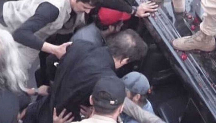 PTI founder Imran Khan being shifted to another vehicle after surviving an assassination attack in Wazirabad on November 3, 2022. — Saudi Gazette