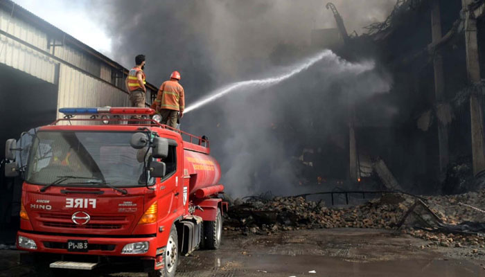 This representational image shows fire brigade officials extinguish fire on October 27, 2024. — PPI