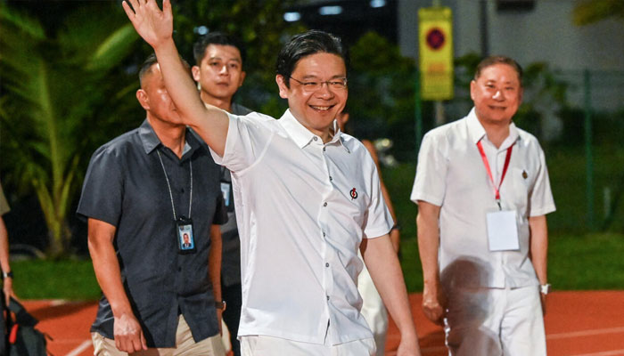 Singapores Prime Minister Lawrence Wong of the Peoples Action Party (PAP) arrives at the partys gathering awaiting the vote count for the general election in Singapore on May 3, 2025. — AFP