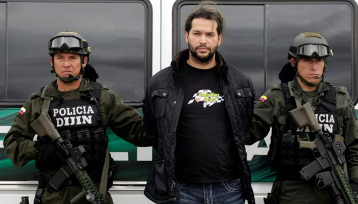 Colombian Erickson Vargas Cardona (centre), also known as Sebastian, is escorted by the Colombian National Police after being arrested in Girardota, close to Medellin, at an airport in Bogota in this August 8, 2012 file photo. —Reuters