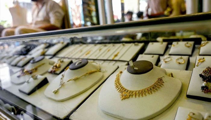 A jeweller waits for a customers at a shop on June 26, 2024. — AFP