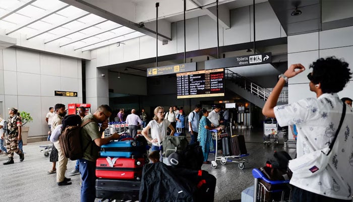 Passengers wait at Terminal 2 of Indira Gandhi International Airport in New Delhi, India, July 1, 2024. —Reuters
