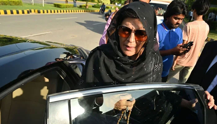 Aleema Khan (centre) sister of former PM Imran Khan, is seen outside the High Court in Islamabad on August 28, 2023. — AFP