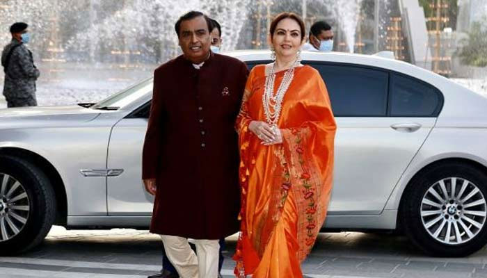 Mukesh Ambani with his wife. — Rediff/File