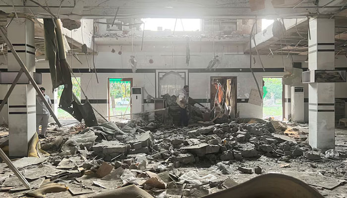 A man walks inside a mosque after it was hit by an Indian strike, in Muridke near Lahore, Pakistan on May 7, 2025. — Reuters