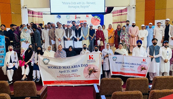 Staff and students holding banners to observed Malaria Day at KMU on May 8, 2025. — Facebook@kmupeshawarofficial