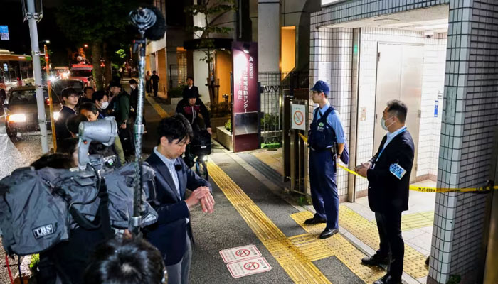 Police officers stand guard at an entrance of Todai-mae Station on Tokyo Metros Namboku Line after a stabbing incident in Tokyo on May 7, 2025. — AFP