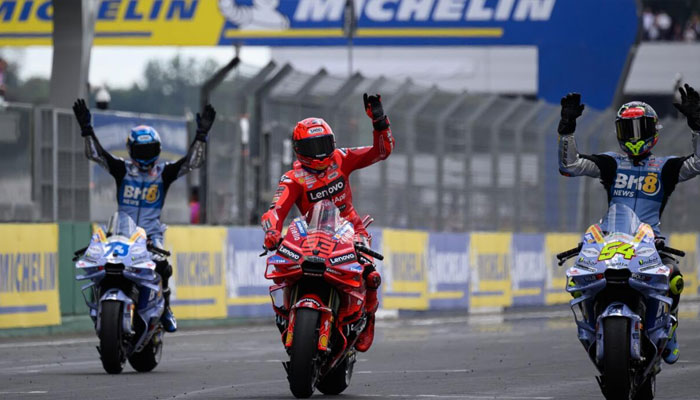 Marc Marquez (C) waving to fans. —AFP/File