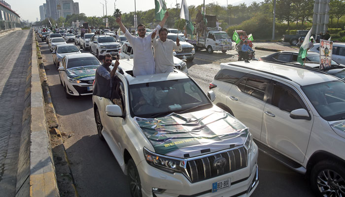 People hold national flag during solidarity rally with Pakistan army as celebration after Pakistan attack on India, at Jinnah Avenue in the federal capital on May 10, 2025. — Online