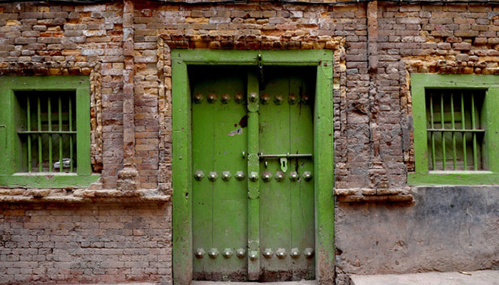 The entrance door and windows of an old house are seen in Pakistan. — Reuters/File