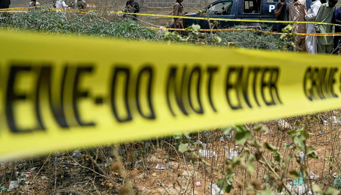 Representational image of a tape used by police to cordon off the crime scene  in Karachi on May 8, 2025.. — AFP