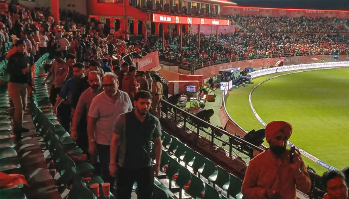 Spectators leave after the Indian Premier League match between Punjab Kings and Delhi Capitals was abandoned. —AFP/File