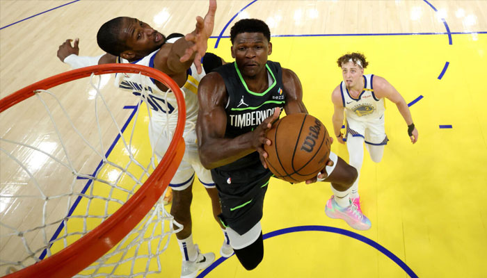 Minnesotas Anthony Edwards drives to the basket on his way to leading the Timberwolves to an NBA playoff victory at Golden State. —AFP/File