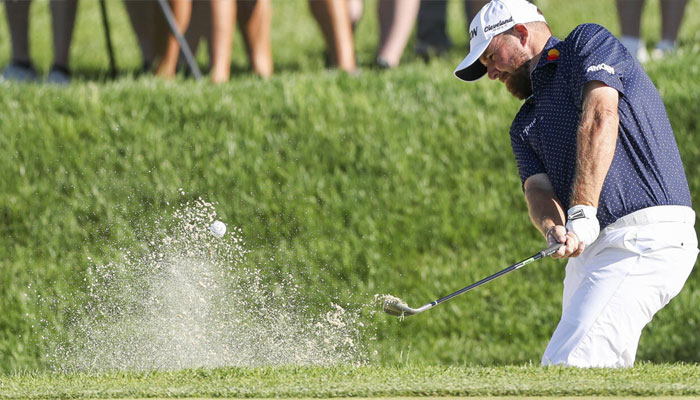 Irelands Shane Lowry hits out of a bunker on the way to a share of the 54-hole lead at the PGA Tour Truist Championship. —AFP/File