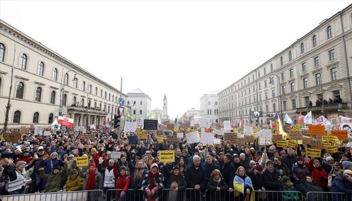 Protesters hold placards during a demonstration against racism and far-right politics in Munich, southern Germany, on Sunday, January 21, 2024. —AFP
