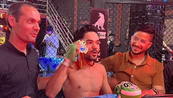 Pakistans Agha Kaleem celebrates winning his match against Azerbaijans Revan Musayev in Baku. — Our Correspondent