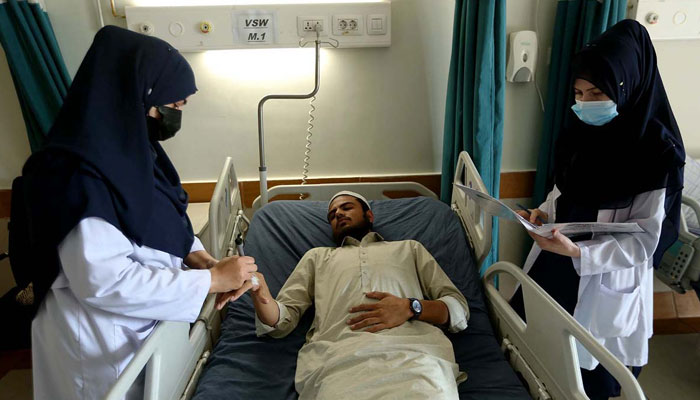 Nursing staff attend to a patient as part of their duties on International Nurses Day at a hospital on May 12, 2025. — APP