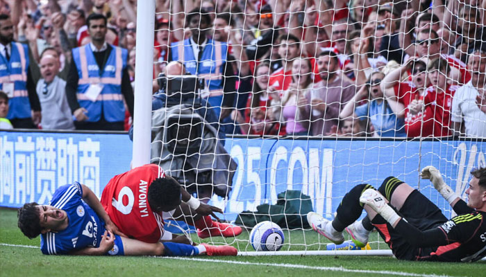 Nottingham Forest striker Taiwo Awoniyi (centre) was hurt after colliding with a post under challenge from Leicesters Facundo Buonanotte (left) while trying to score a winner in a 2-2 draw at the City Ground. — AFP/File