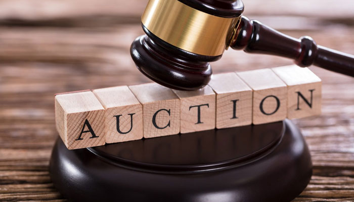 The representational image shows the word auction  written under a gavel. — pexels/File