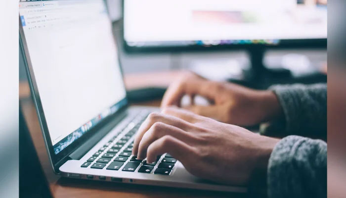 This representational image shows a person working on Laptop. — Unsplash/File