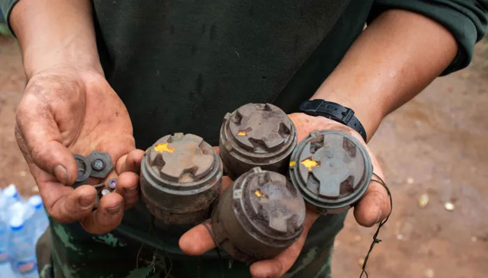 A person holds landmines.—AFP/File