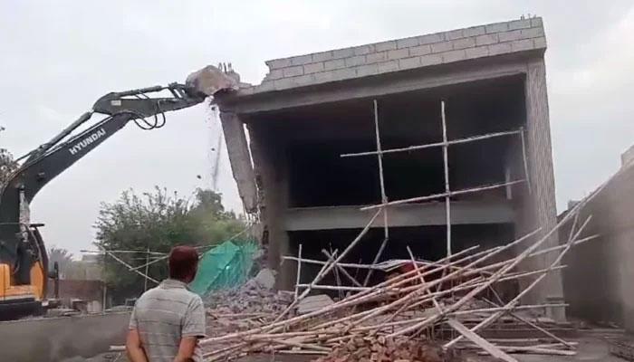 In this screengrab Lahore Development Authority (LDA) personnel conducting an operation against illegal construction on March 27, 2024. — Facebook@LahoreDevelopmentAuthority