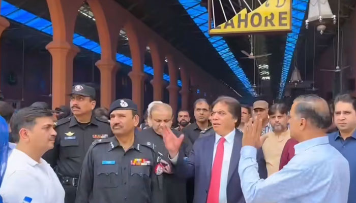 Federal Minister for Railways M Hanif Abbasi (centre) speaks during his surprise visit to Lahore Railway Station on May 15, 2025. — Screengrab via Facebook@hanifabbasiNA56