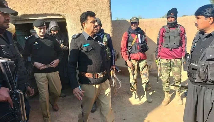 A KP Police official interacts with police personnel during a visit to an undisclosed area on January 10, 2024. — Facebook@Khyber Pakhtunkhwa Police
