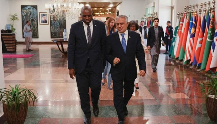 British Foreign Secretary David Lammy (left) and Deputy Prime Minister Ishaq Dar walk together during an event in Islamabad on May 16, 2025. — British High Commission in Islamabad