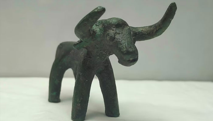 A 2,500-year-old bronze bull idol that was unearthed at the archaeological site of Olympia is displayed in a laboratory, in ancient Olympia, Greece, March 1, 2021. Picture taken March 1, 2021. — Reuters