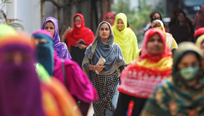 Garment workers come out of a factory during lunch hours at the Ashulia area, outskirts of Dhaka, Bangladesh, November 8, 2023. — Reuters
