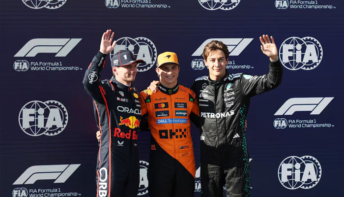 McLarens Oscar Piastri celebrates after qualifying in pole position with second placed Red Bulls Max Verstappen and third placed Mercedes George Russell, May 17, 2025. —Reuters