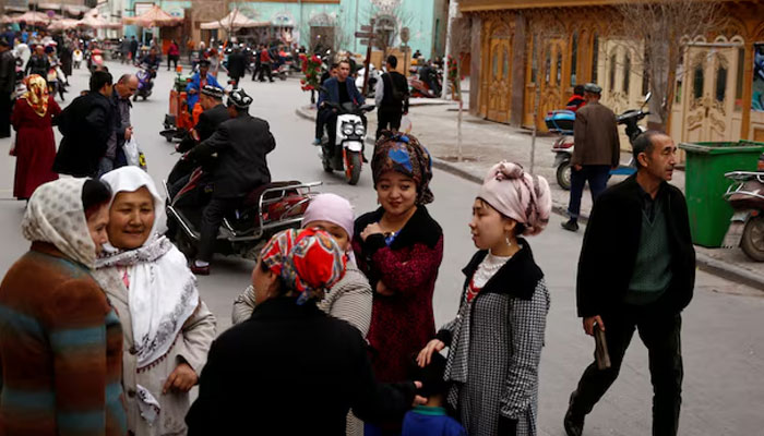 People mingle in the old town of Kashgar, Xinjiang Uighur Autonomous Region, China, March 22, 2017. — Reuters