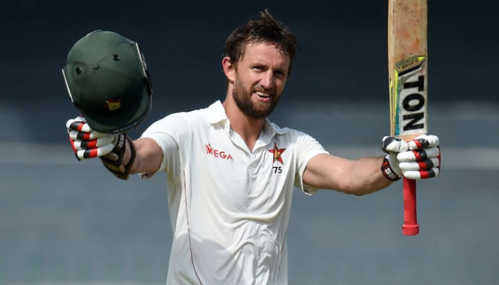 Craig Ervine celebrates after scoring a century (100 runs) during the first day of the only one-off Test match between Sri Lanka and Zimbabwe at the R Premadasa Cricket Stadium in Colombo on July 14,2017. — AFP