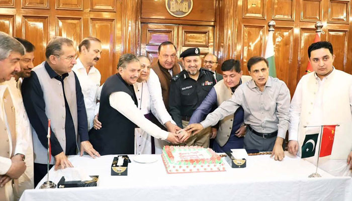 IG Police Khyber Pakhtunkhwa Zulfiqar Hameed and others cutting a cake during celebration ceremony of the 74th anniversary of diplomatic relations between Pakistan and China at the PA Hall in Peshawar on May 21, 2025. — PPI