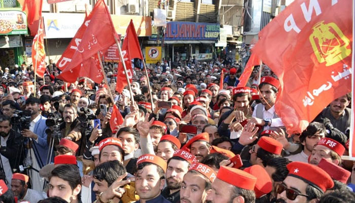 Workers and supporters of the Awami National Party hold flags in a rally on March 8, 2024. — Facebook@Awami National Party
