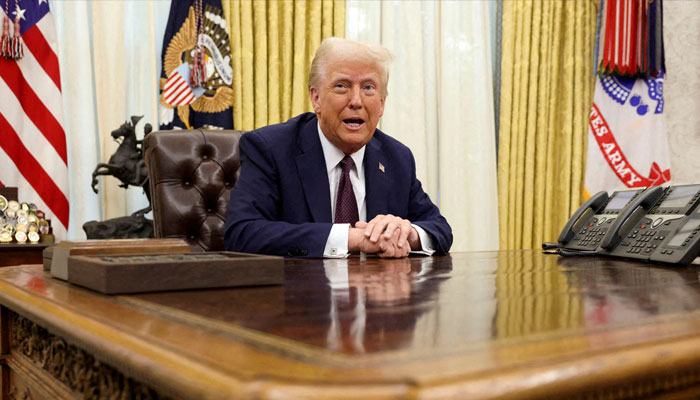 US President Donald Trump sits in the Oval Office of the White House, as he signs executive orders, in Washington, US, January 23, 2025. — Reuters
