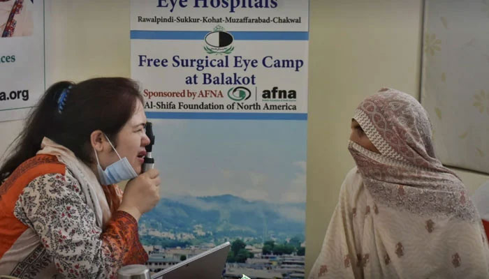 A female doctor examines the eyes of a patient on June 31, 2024. — Facebook@Al-Shifa Trust Eye Hospital