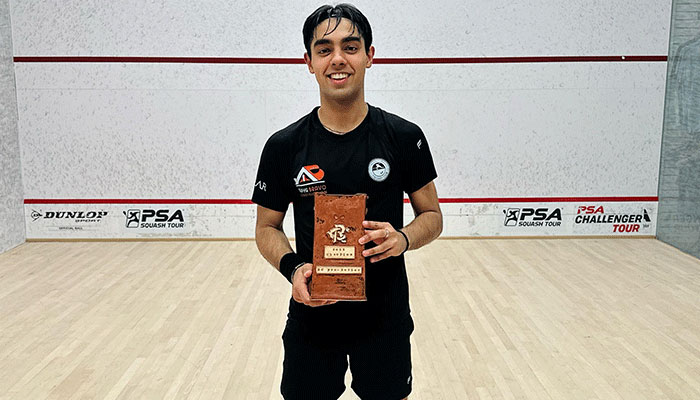 Ashab Irfan poses with the championship trophy in St. Louis, Missouri. — Geo Super/File